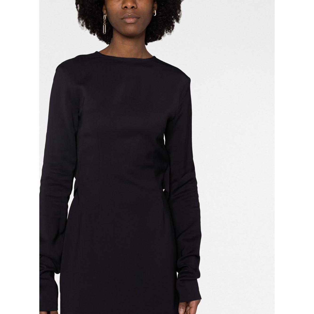 Woman wearing 032C Kicked Back black structured short dress with long sleeves and cut-out detailing.