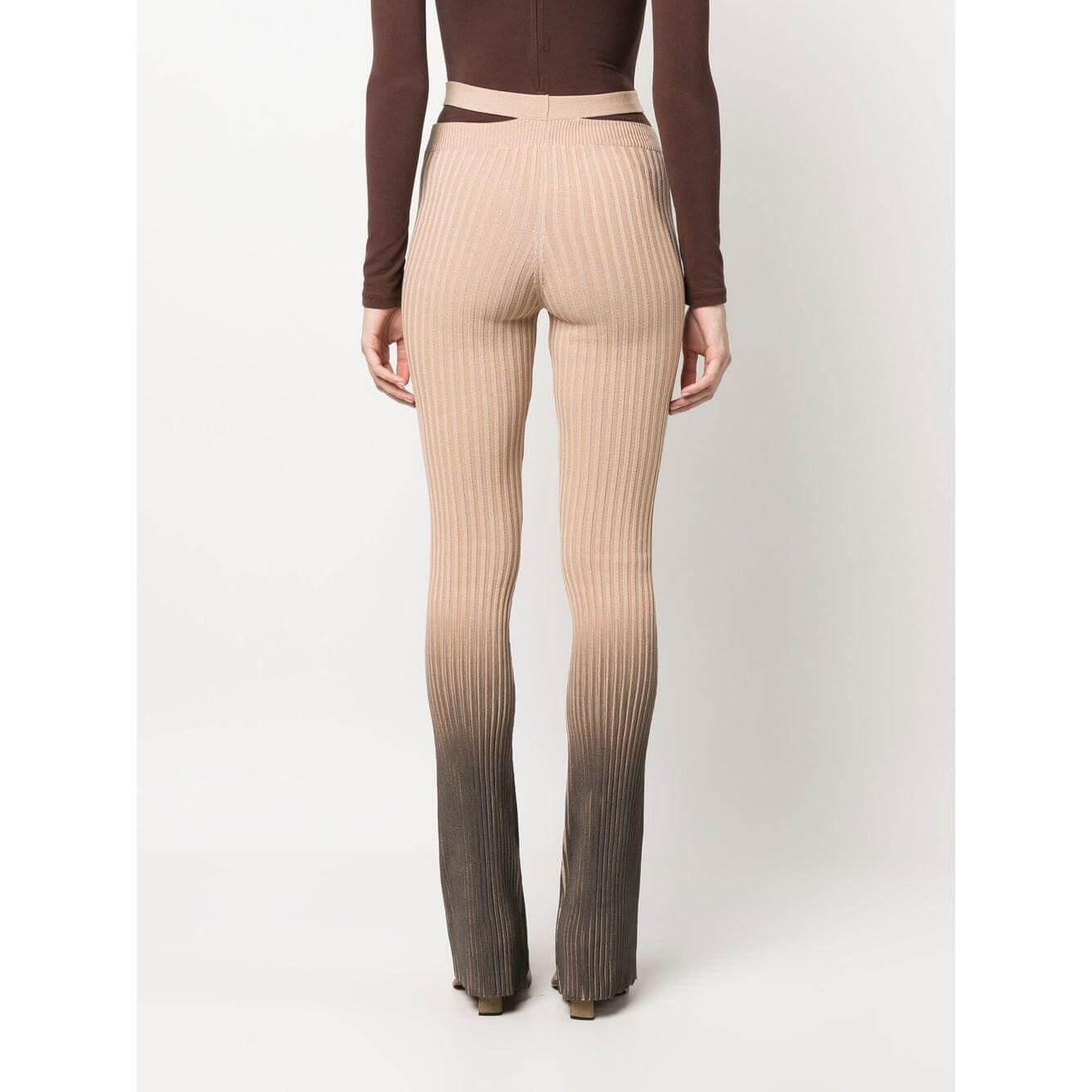 Andrea Adamo ribbed flared trousers in brown with ombré effect, high-waisted and cut-out detailing, showcasing stretch design.