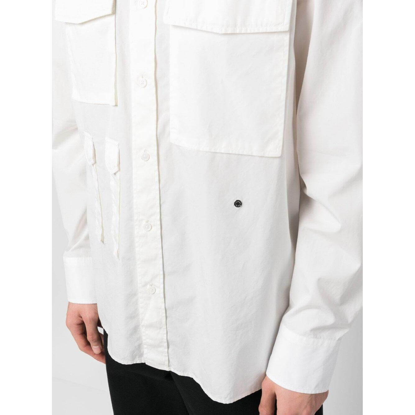 Off-white Études four-pocket cotton shirt with classic collar and long sleeves, featuring buttoned cuffs and a straight hem.