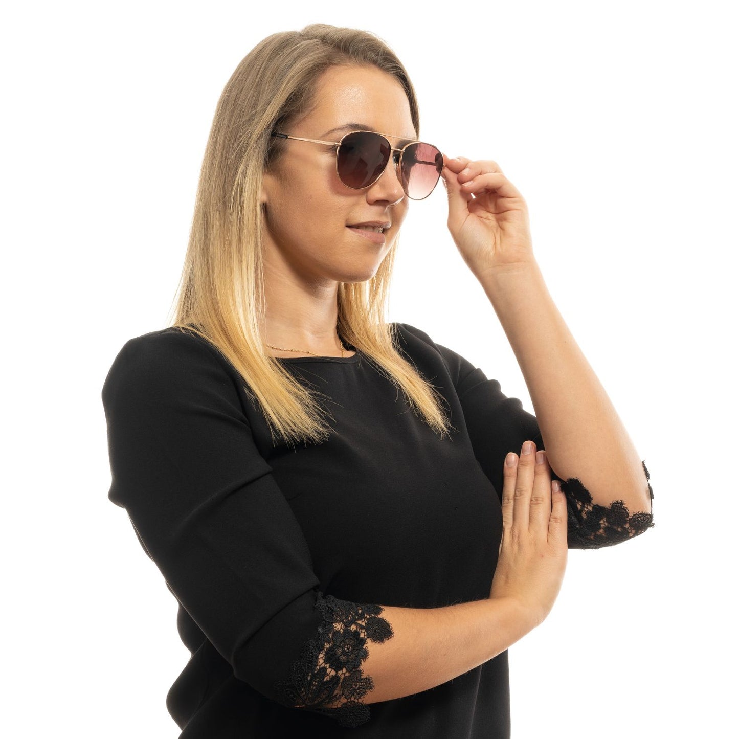Woman wearing Ted Baker rose gold aviator sunglasses with gradient brown lenses and full-rim metal frame in a stylish pose.