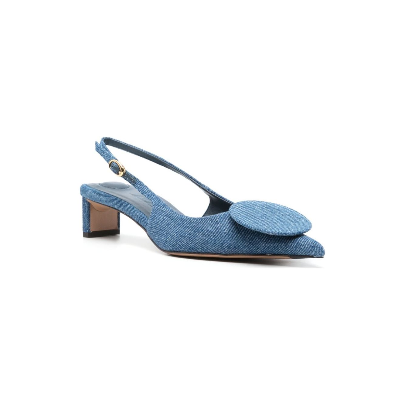 Cerulean blue Jacquemus Duelo slingbacks with denim pointed toe and circle appliqué, 40mm sculpted heel, leather insole, and buckle strap.