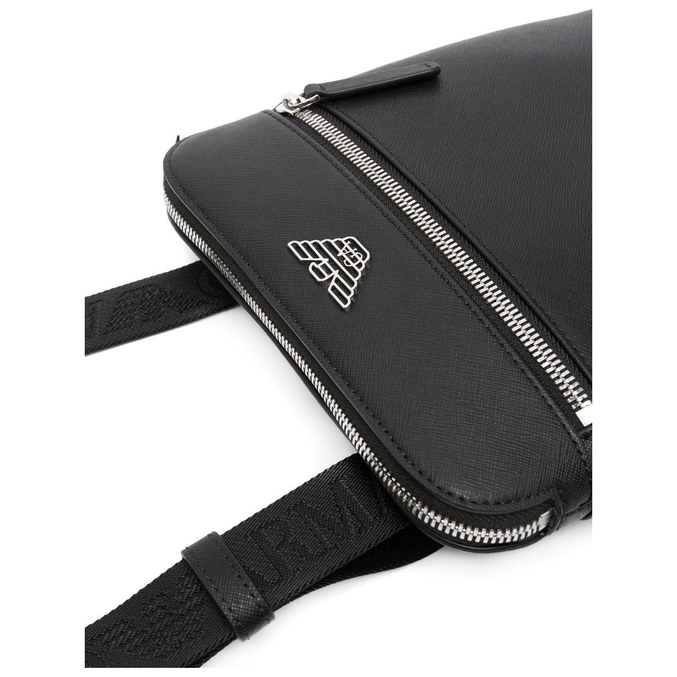 Emporio Armani black faux-leather shoulder bag with silver eagle logo, zip closure, and adjustable logo-print strap.
