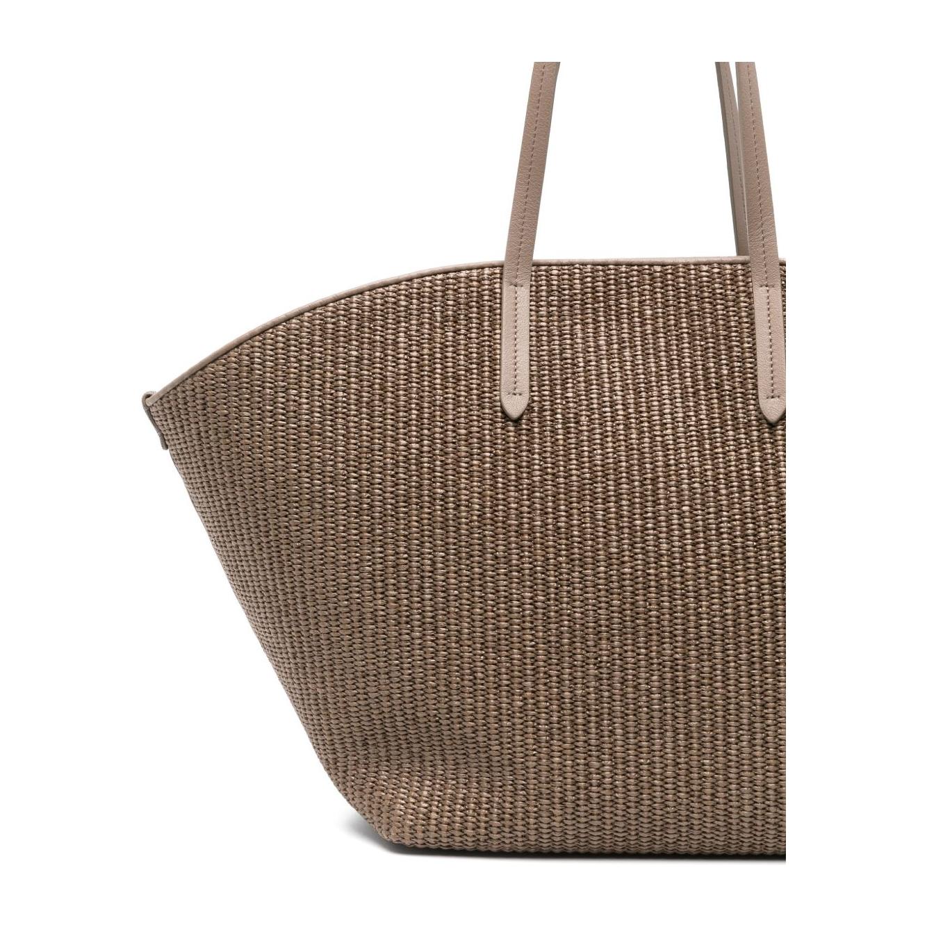 Brunello Cucinelli brown woven tote bag with Monili chain detail, featuring two flat top handles and a magnetic fastening, side view.