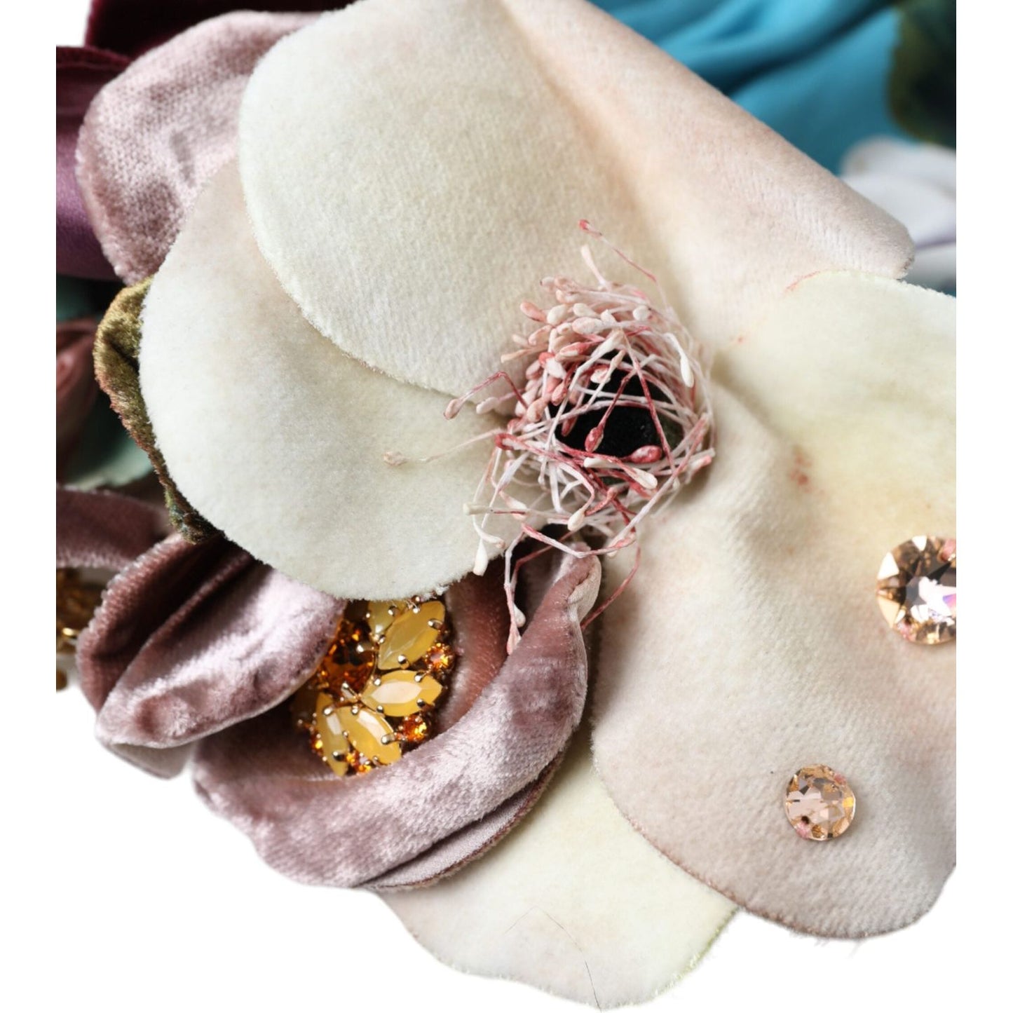 Close-up of Dolce & Gabbana blue floral motif turban hat, featuring silk and elastane with intricate decorative details.