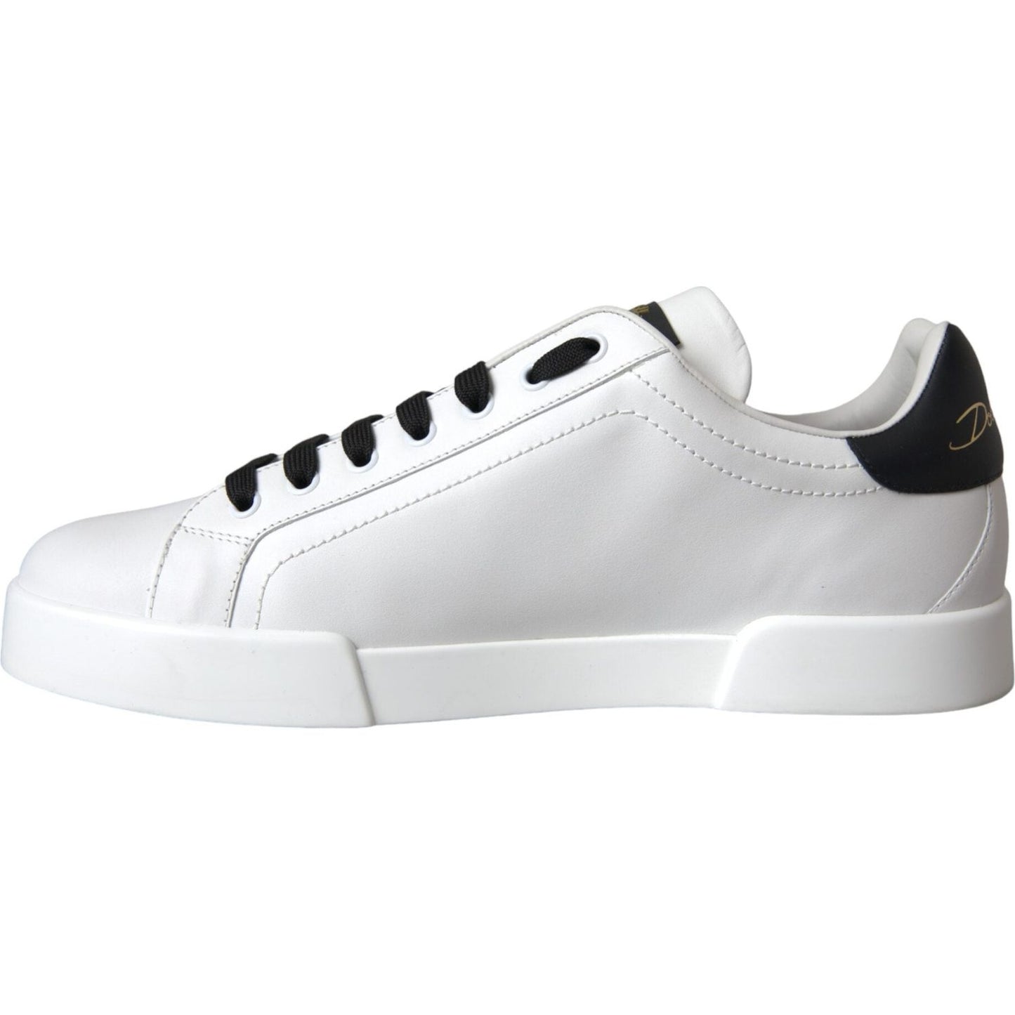 Dolce & Gabbana white leather low-top sneakers with DG logo, black accents, and rubber sole, side view. Made in Italy.