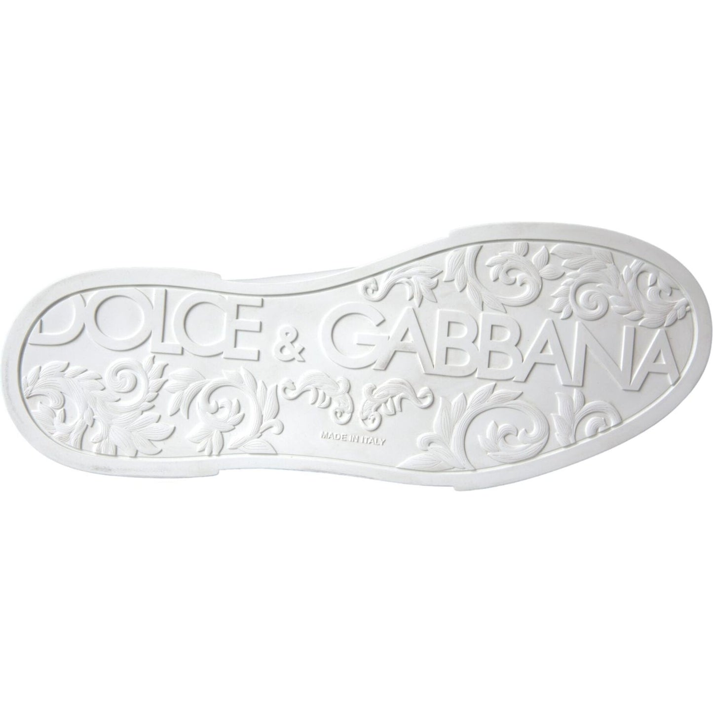Sole view of white Dolce & Gabbana sneakers with embossed logo and floral pattern.