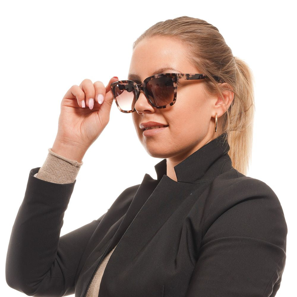 Woman wearing square Bally brown acetate sunglasses with gradient lenses