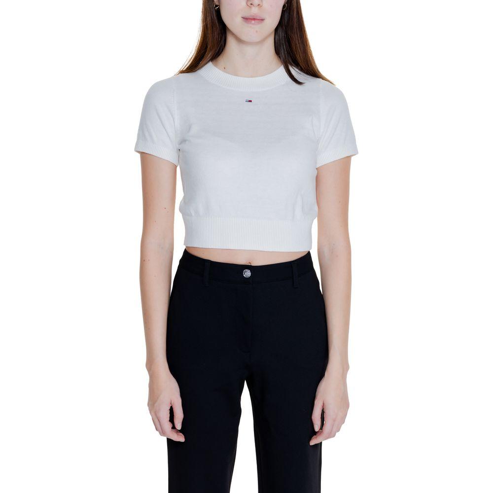 Model wearing Tommy Hilfiger Women's Short Sleeve White Organic Cotton Crop Top, part of Fall/Winter Collection.