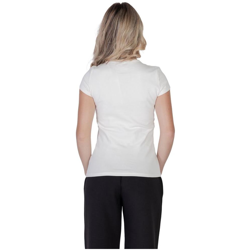 Back view of woman wearing Guess Active cream cotton t-shirt, highlighting fitted cut and elegant style.