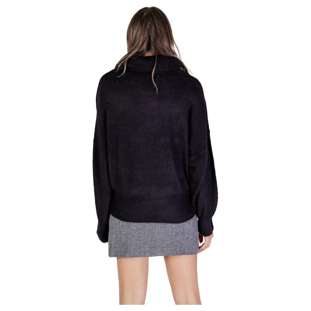 Back view of woman wearing ICHI Black Acrylic Sweater from Fall/Winter collection, featuring stylish women's knitwear design.