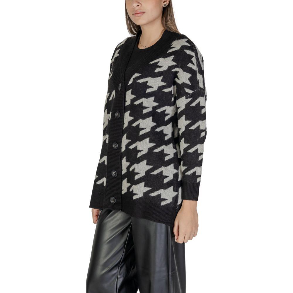 Vero Moda black and white acrylic cardigan for women, fall/winter collection. Stylish knitwear with bold patterns, 100% acrylic.