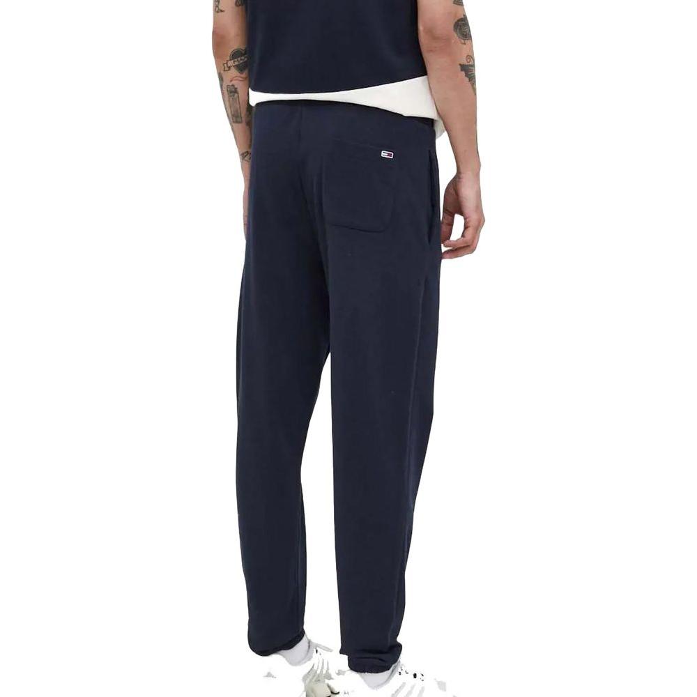 Men's blue Tommy Hilfiger sports pants, autumn/winter collection, made of 87% recycled cotton and 13% polyester.