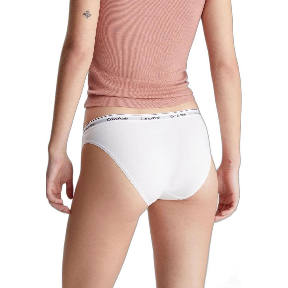 Woman wearing Calvin Klein white cotton underwear with logo waistband, showcasing a stylish and comfortable fit, ideal for everyday wear.