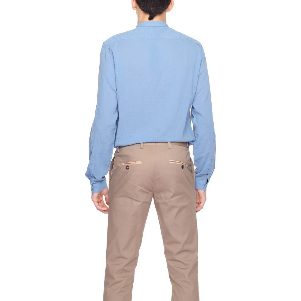 Back view of a man wearing a blue Antony Morato long sleeve cotton shirt from the Spring/Summer collection, paired with beige pants.