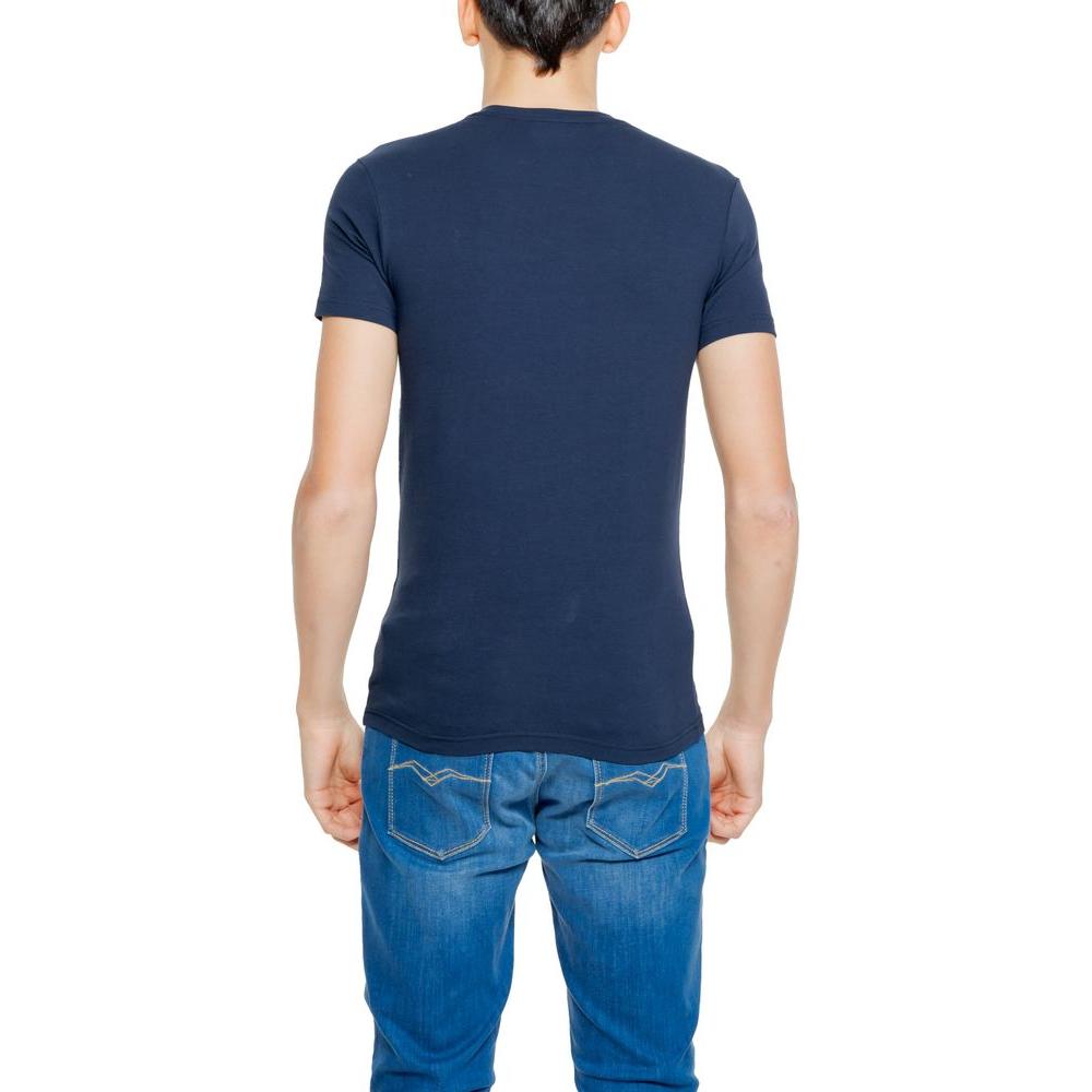 Back view of a man wearing a blue Emporio Armani Underwear cotton t-shirt paired with jeans, highlighting fit and comfort.