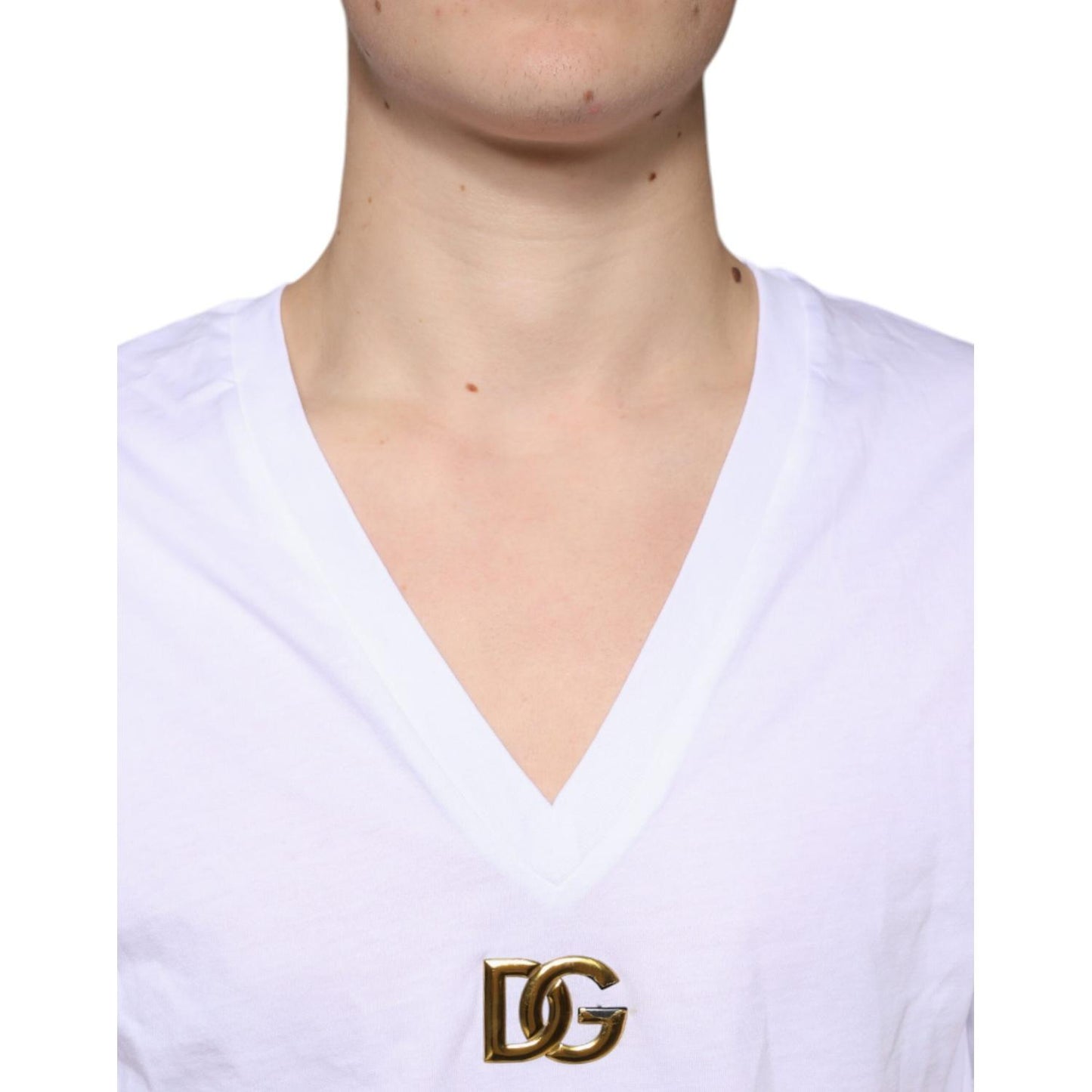 Dolce & Gabbana white V-neck T-shirt with metal DG logo, featuring a cotton fabric and short sleeves, minor stain and color defect visible.