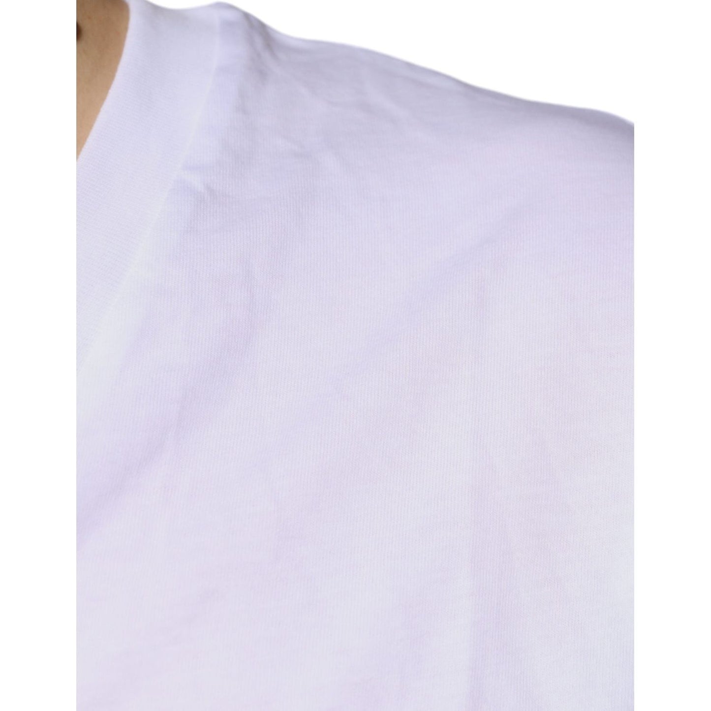 Close-up of white Dolce & Gabbana cotton V-neck T-shirt with visible stain and defect.