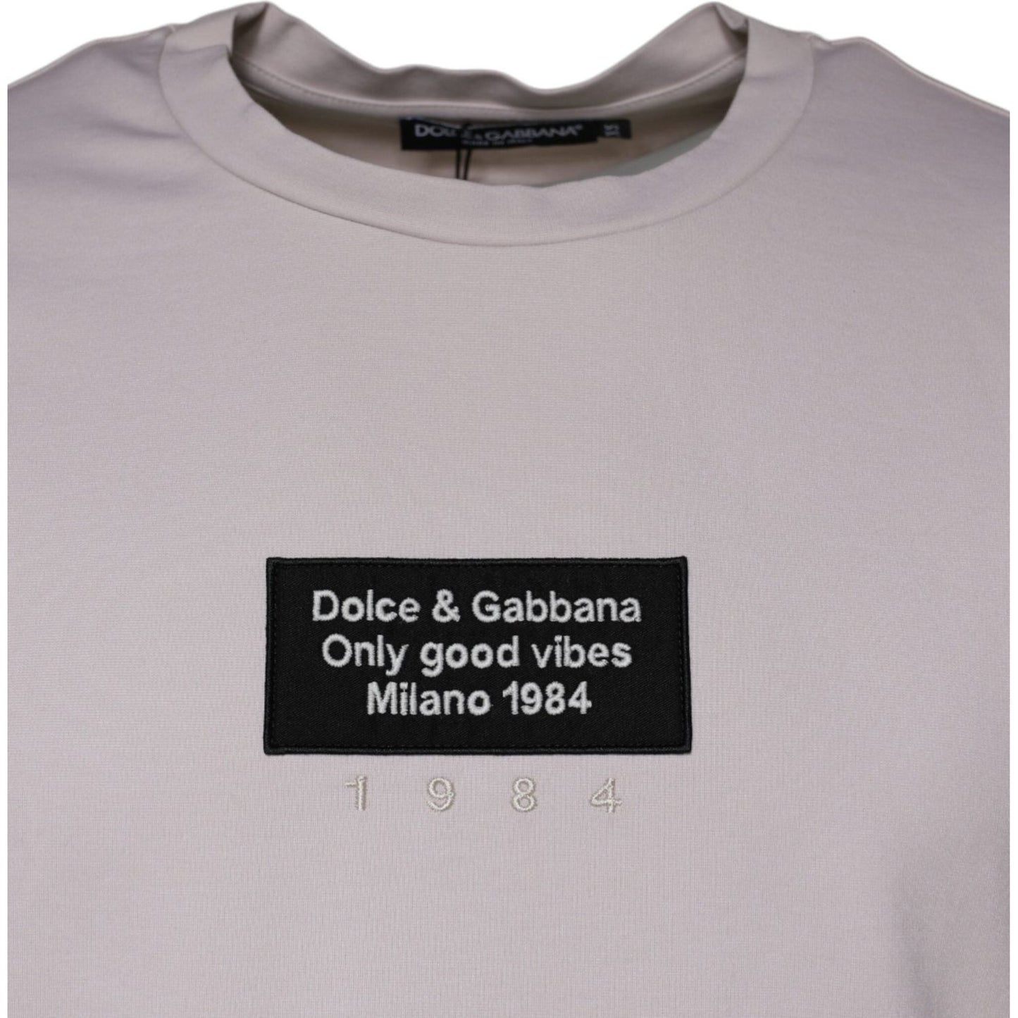 Dolce & Gabbana beige crew neck t-shirt with logo and graphic print, "Only Good Vibes Milano 1984," made of cotton blend.