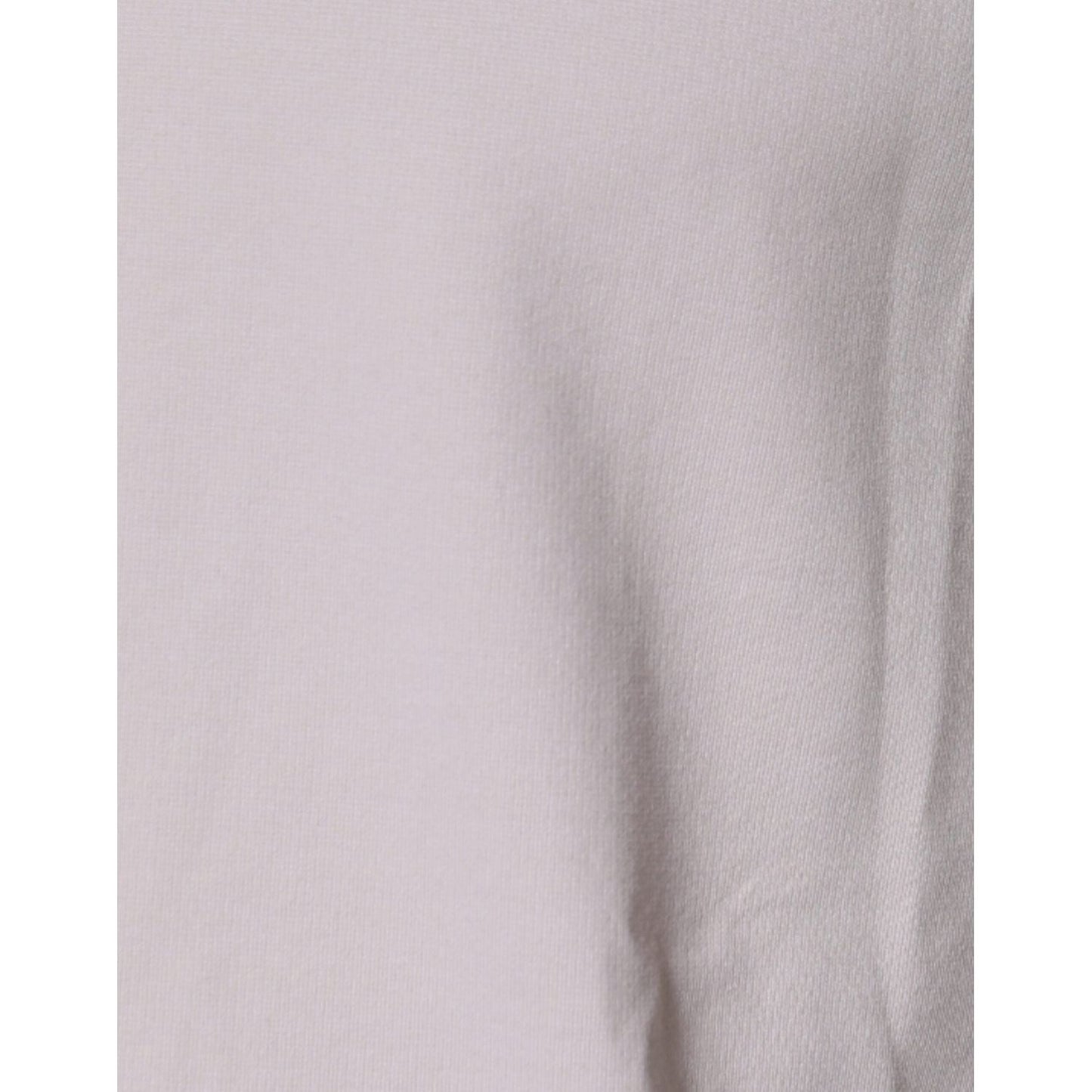 Close-up of Dolce & Gabbana beige cotton blend T-shirt fabric texture showing subtle creasing.