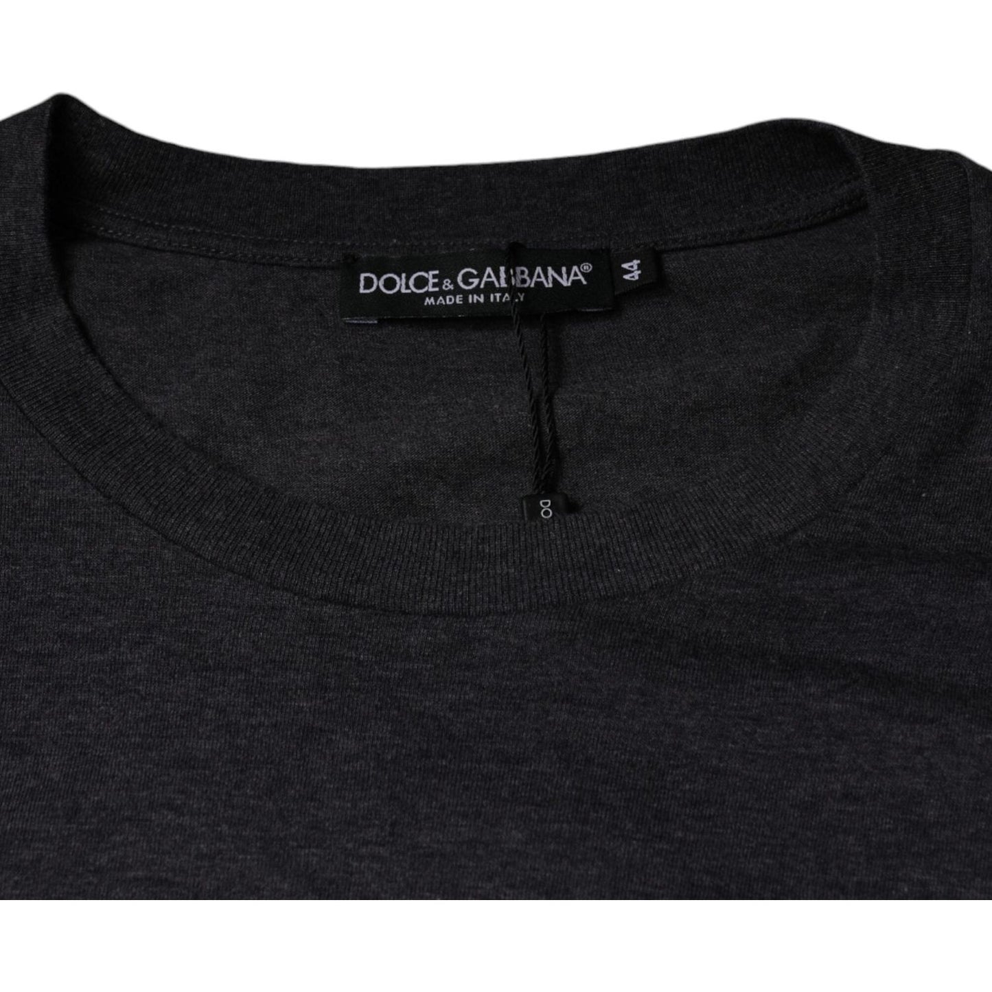 Dolce & Gabbana gray cotton crew neck t-shirt with logo patch, close-up of the neck and label. Made in Italy.