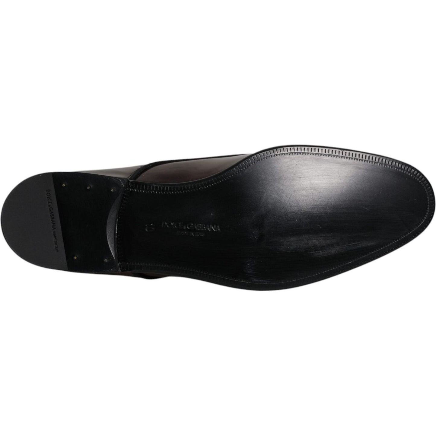 Sole view of Dolce & Gabbana Peacock Leather Men's Derby Dress Shoes, highlighting craftsmanship and logo details.