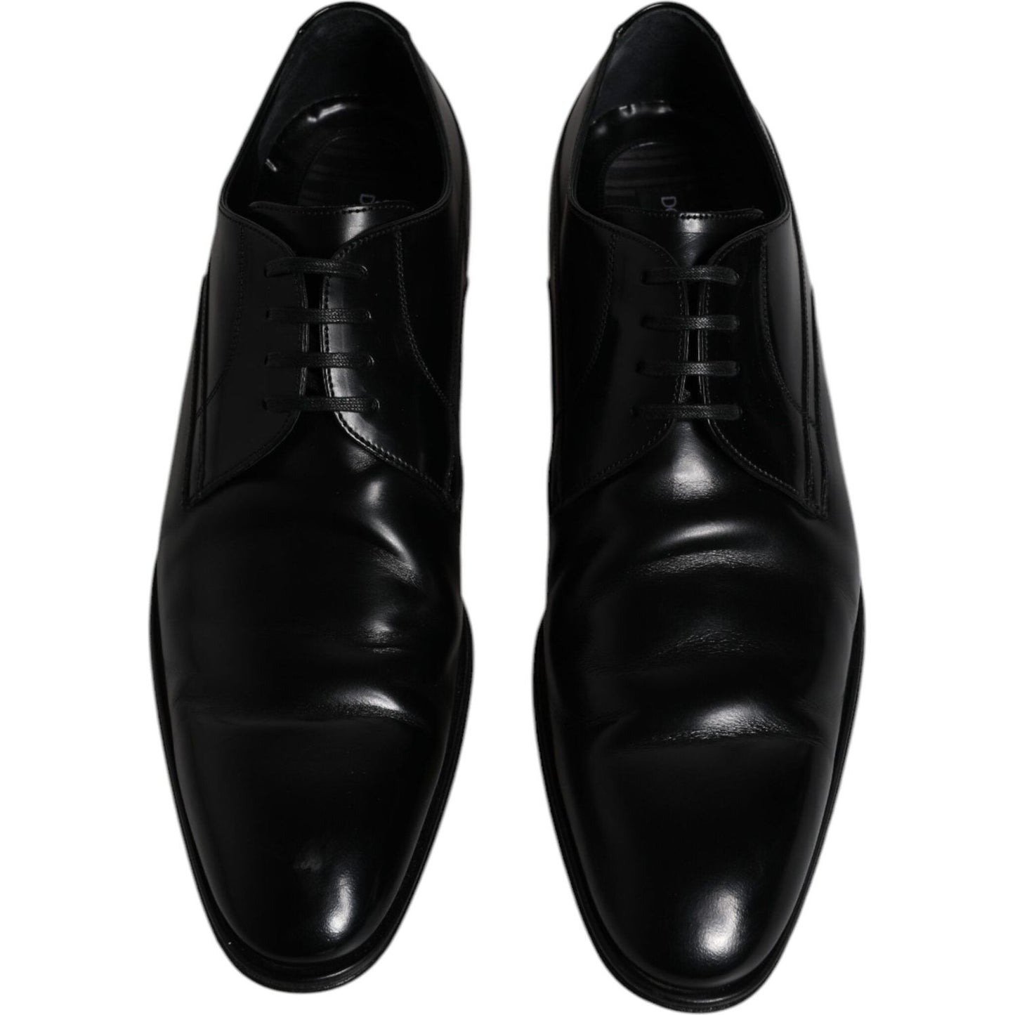 Dolce & Gabbana black leather derby shoes for men, formal dress style, lace-up closure, slightly pre-owned with minor wear, made in Italy.