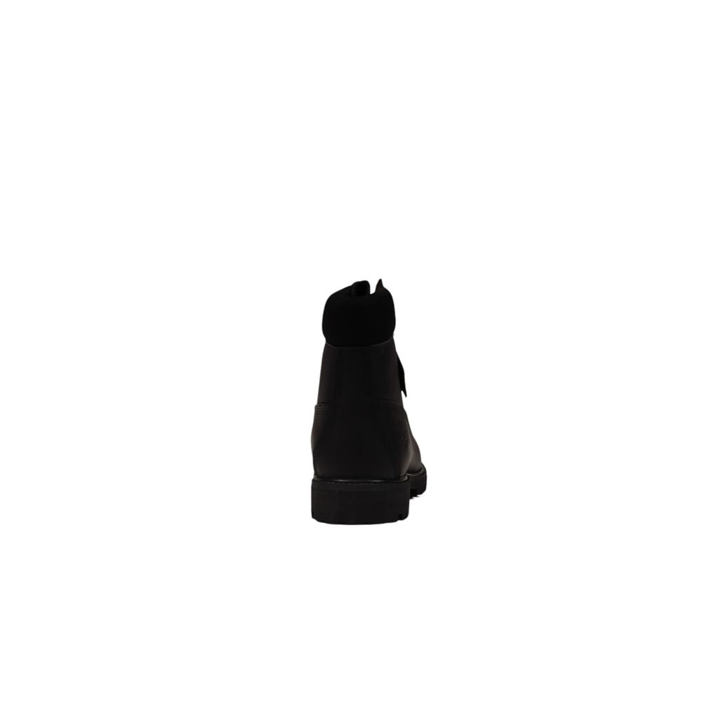 Back view of a Timberland black suede restorer brush boot for men, ideal for fall and winter collections.