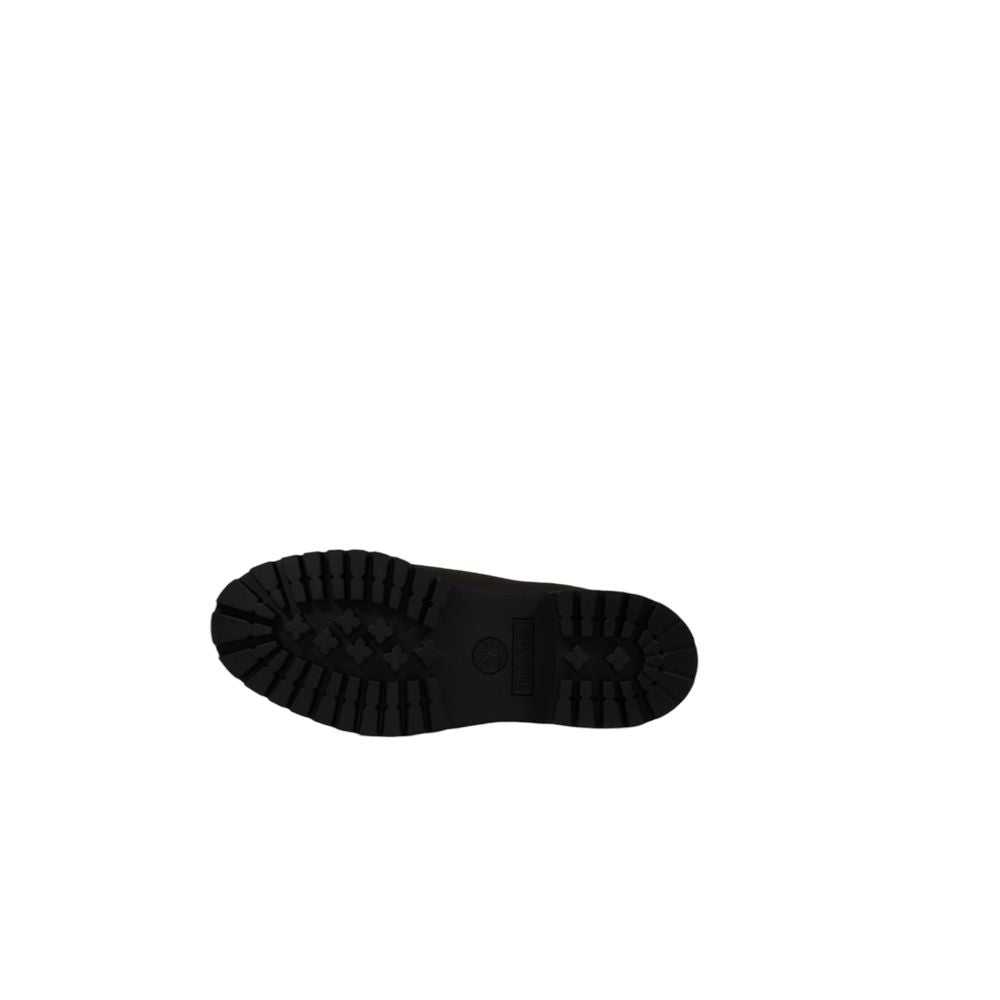 Image of the sole of a Timberland Black Suede Restorer Brush Boot, showcasing durable tread pattern for men’s fall and winter footwear.