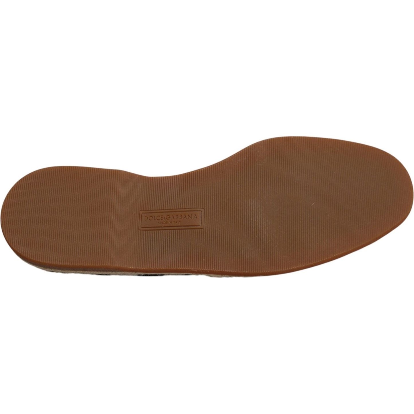 Rubber sole of Dolce & Gabbana black and white striped slip-on espadrille shoes showcasing logo and craftsmanship.