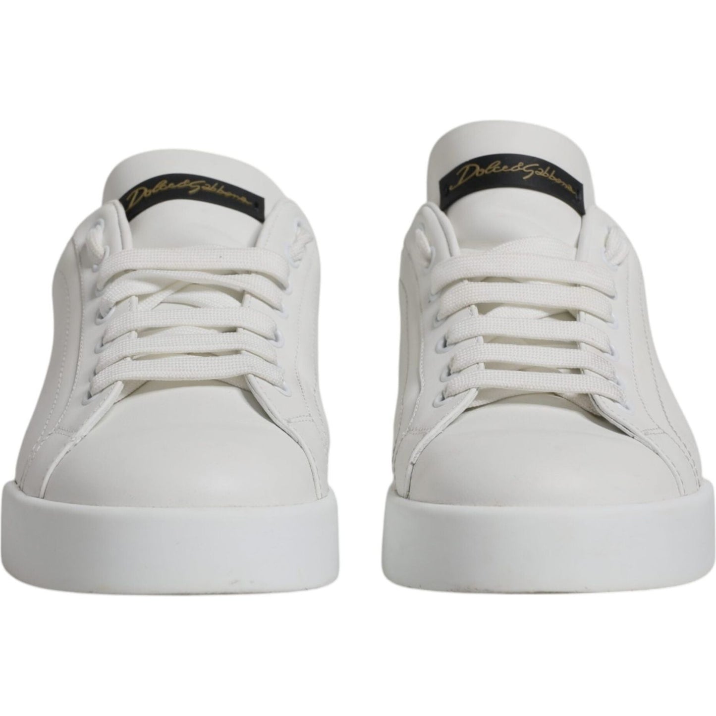 Front view of Dolce & Gabbana white leather low top sneakers with logo detail and rubber sole, slightly preowned.