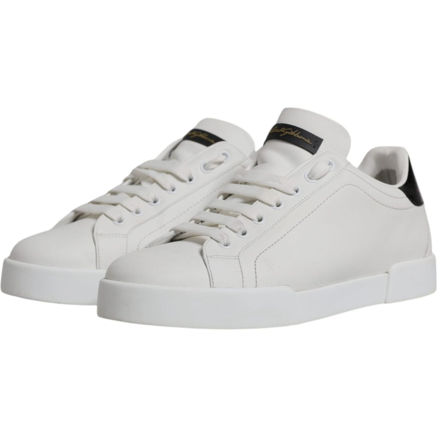 Dolce & Gabbana white leather low top sneakers with black logo detail and rubber sole.