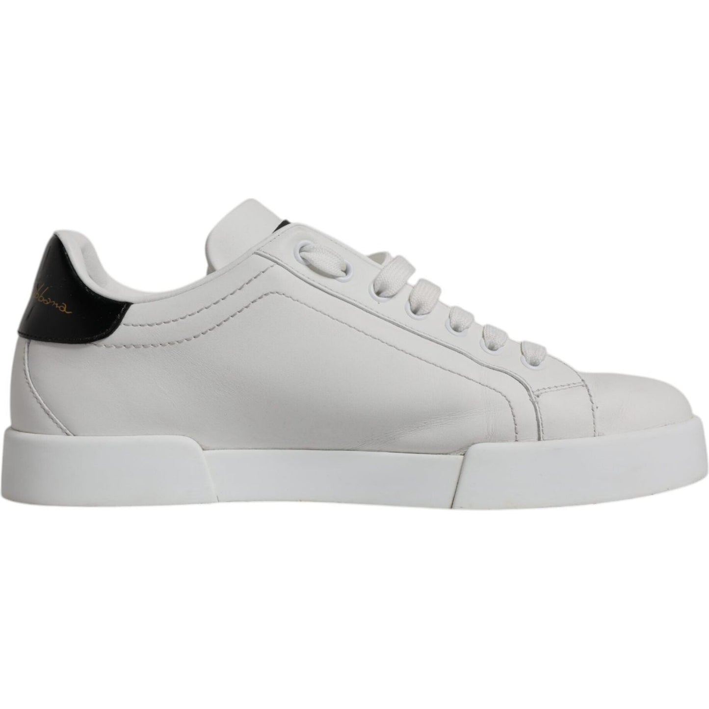 Dolce & Gabbana white leather low-top sneakers with black accents, featuring a rubber sole and lace-up closure. Made in Italy.