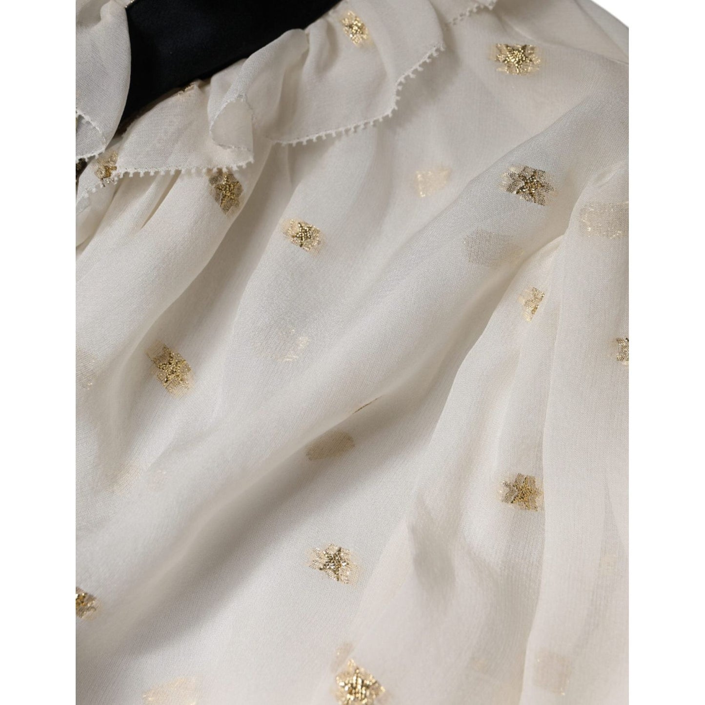 Dolce & Gabbana off white silk ascot blouse with gold details, close-up of fabric texture and black necktie scarf.