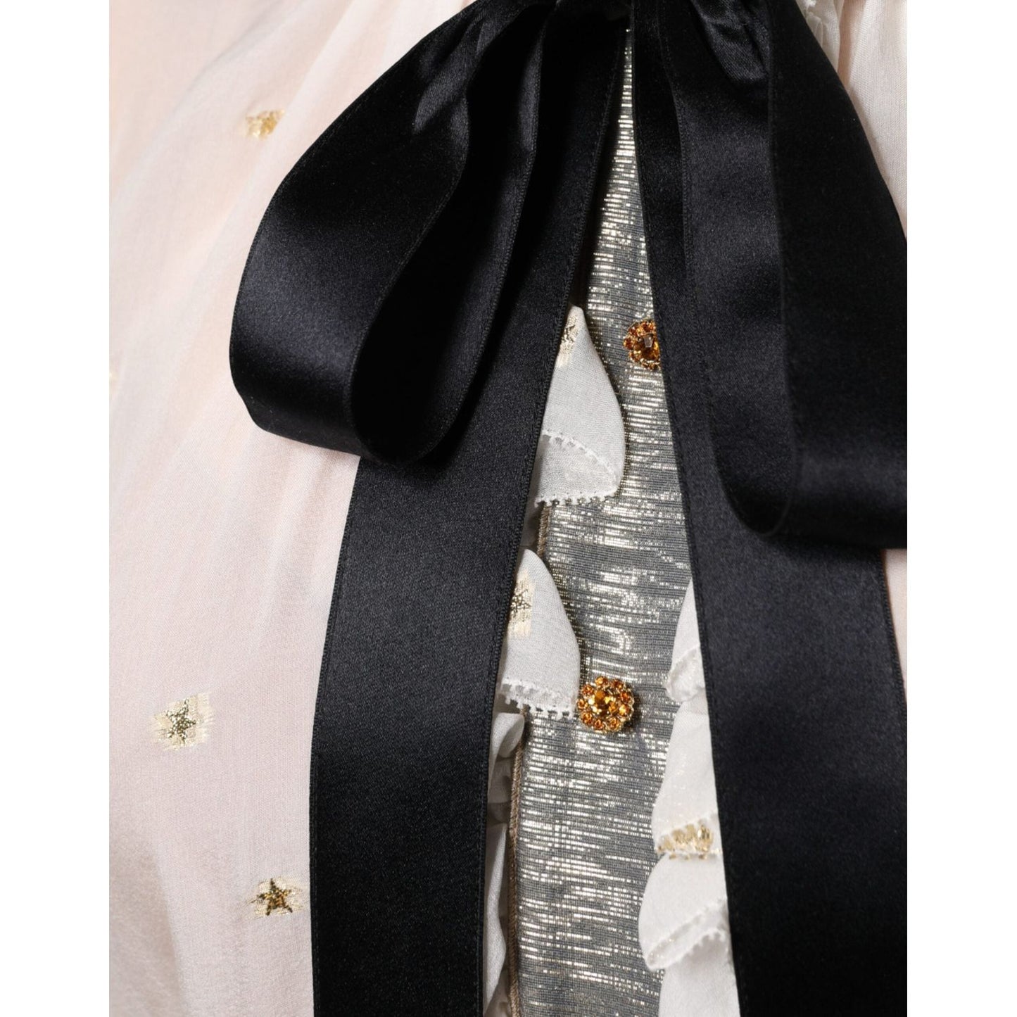 Dolce & Gabbana off white silk blouse with ascot collar, black necktie, and gold accents. Material: silk blend. Minor stain visible.
