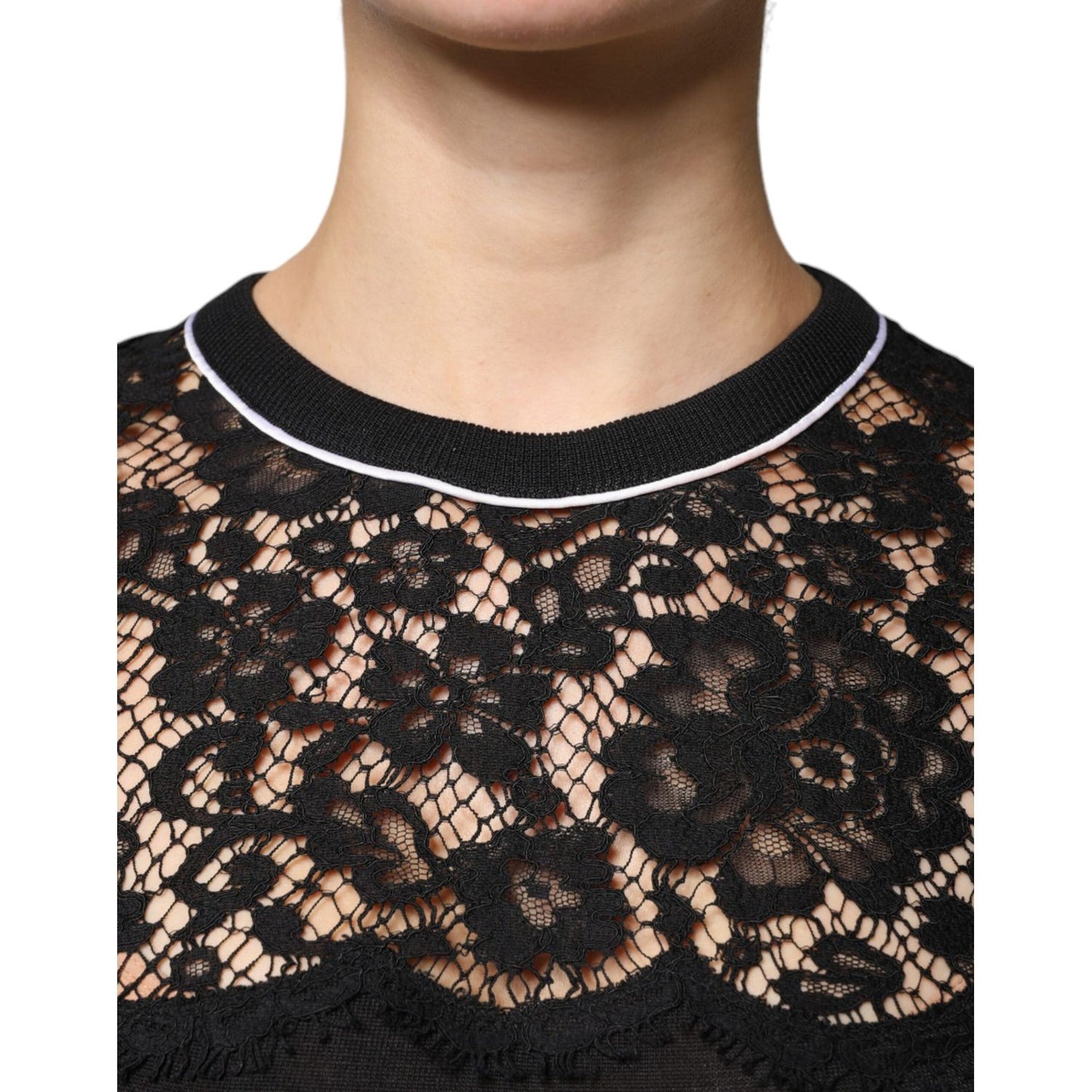Close-up of Dolce & Gabbana black floral lace silk pullover blouse top, featuring intricate lace design and luxury craftsmanship.