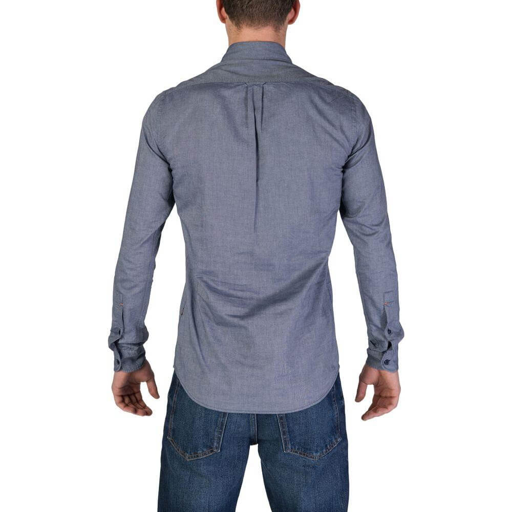 Back view of a man wearing a Hugo Boss blue cotton long sleeve shirt from the Fall/Winter collection