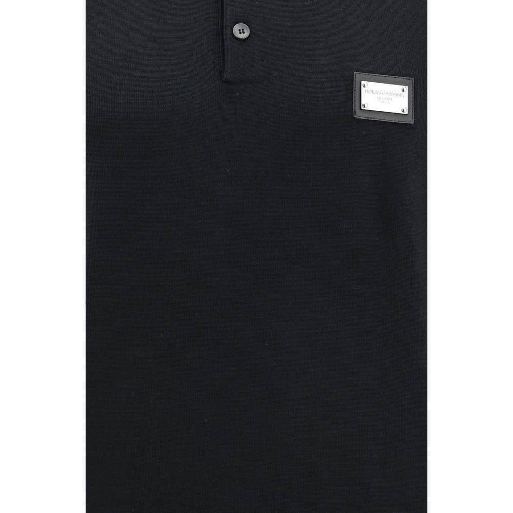 Dolce & Gabbana black polo shirt with logo detail, classic collar, and front buttons for an elegant look.