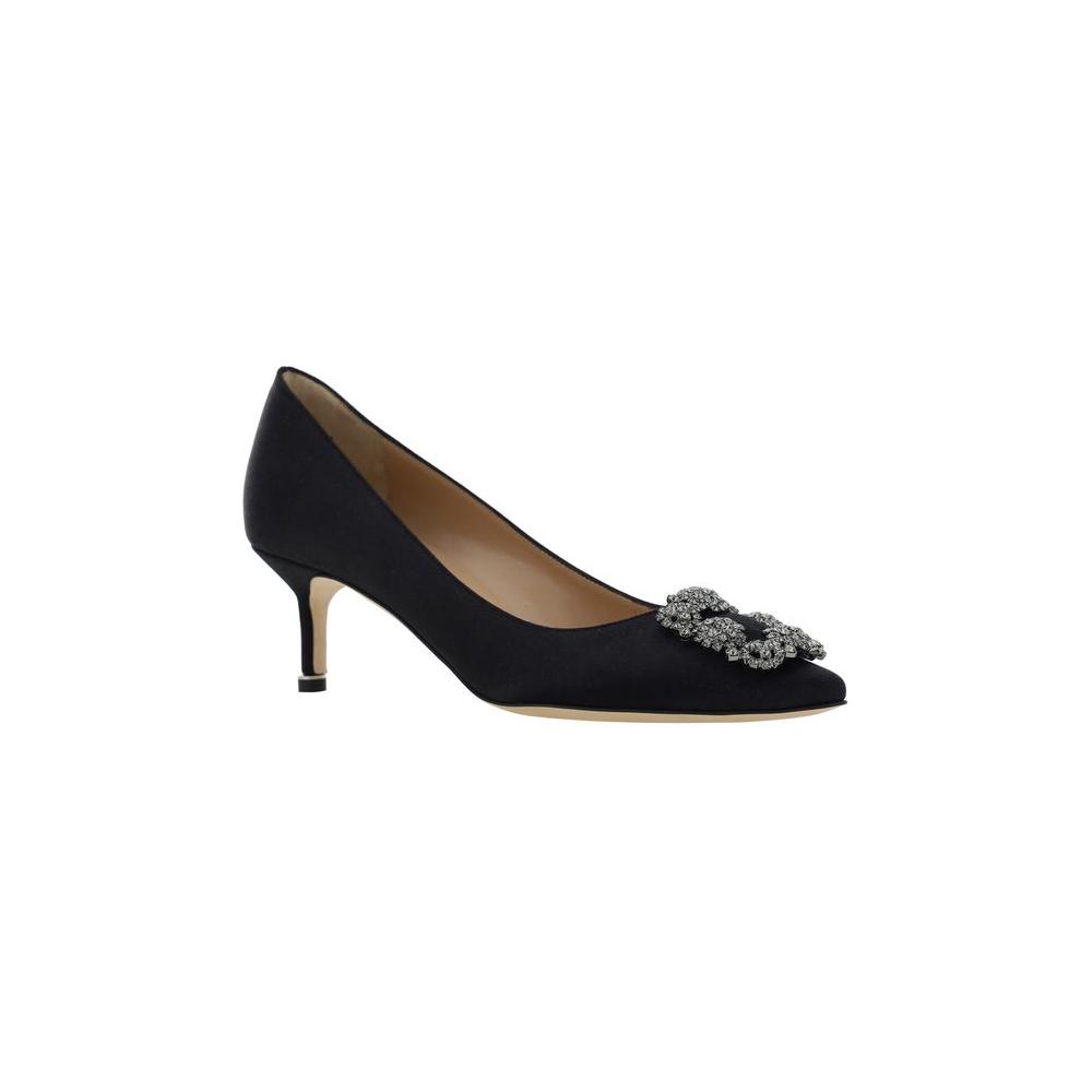 Manolo Blahnik Hangisi Pumps in black silk satin with Swarovski crystal buckle, almond toe, leather stiletto heel, and logo insole.