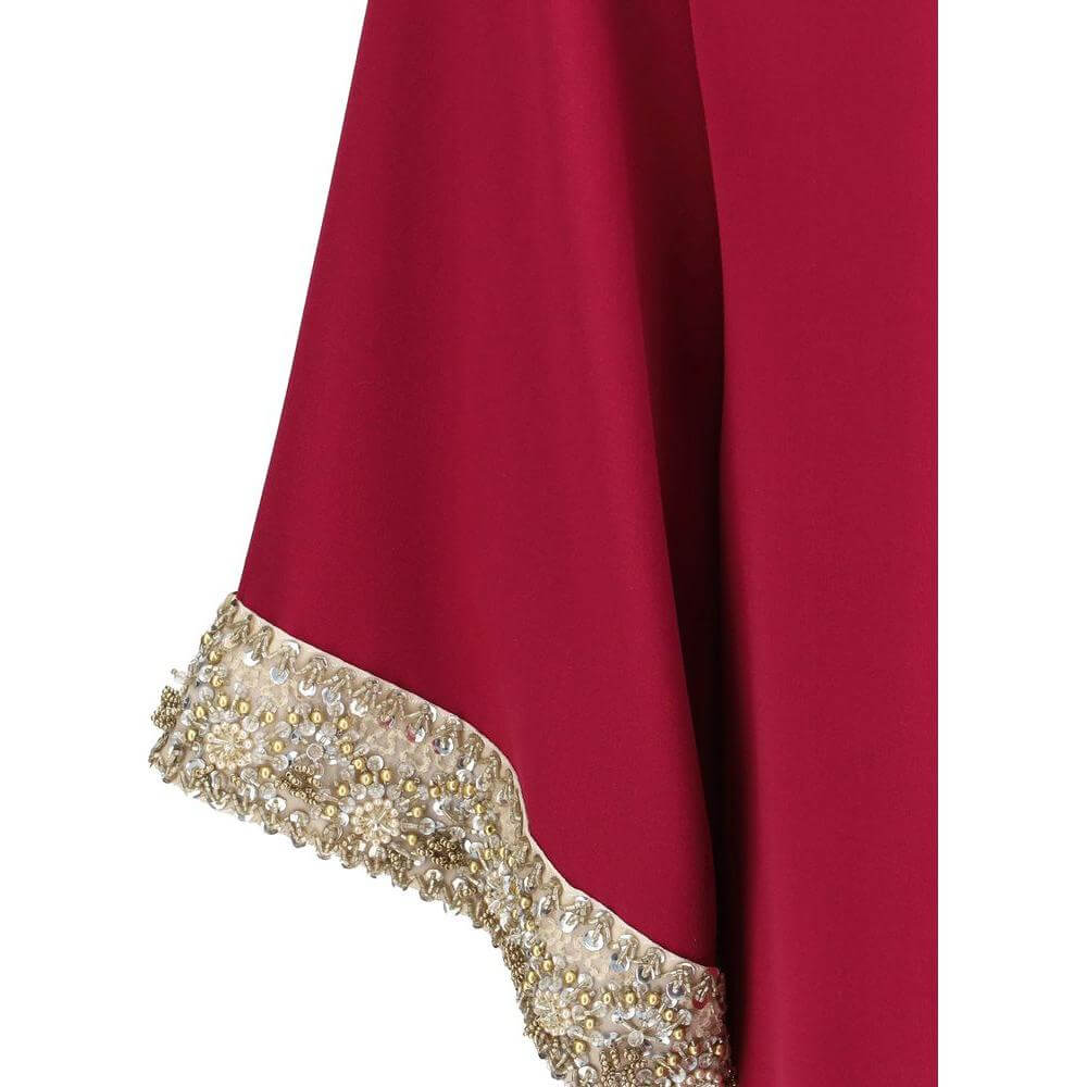 Valentino Jewel Top's flared sleeve with pearl and bead embroidery, showcasing luxury detail on rich red fabric for a chic look.