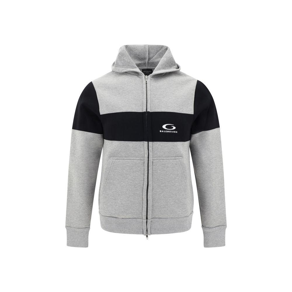 Balenciaga cotton hoodie with contrasting panel design, featuring a double-slider zipper and side welt pockets for a modern urban style.