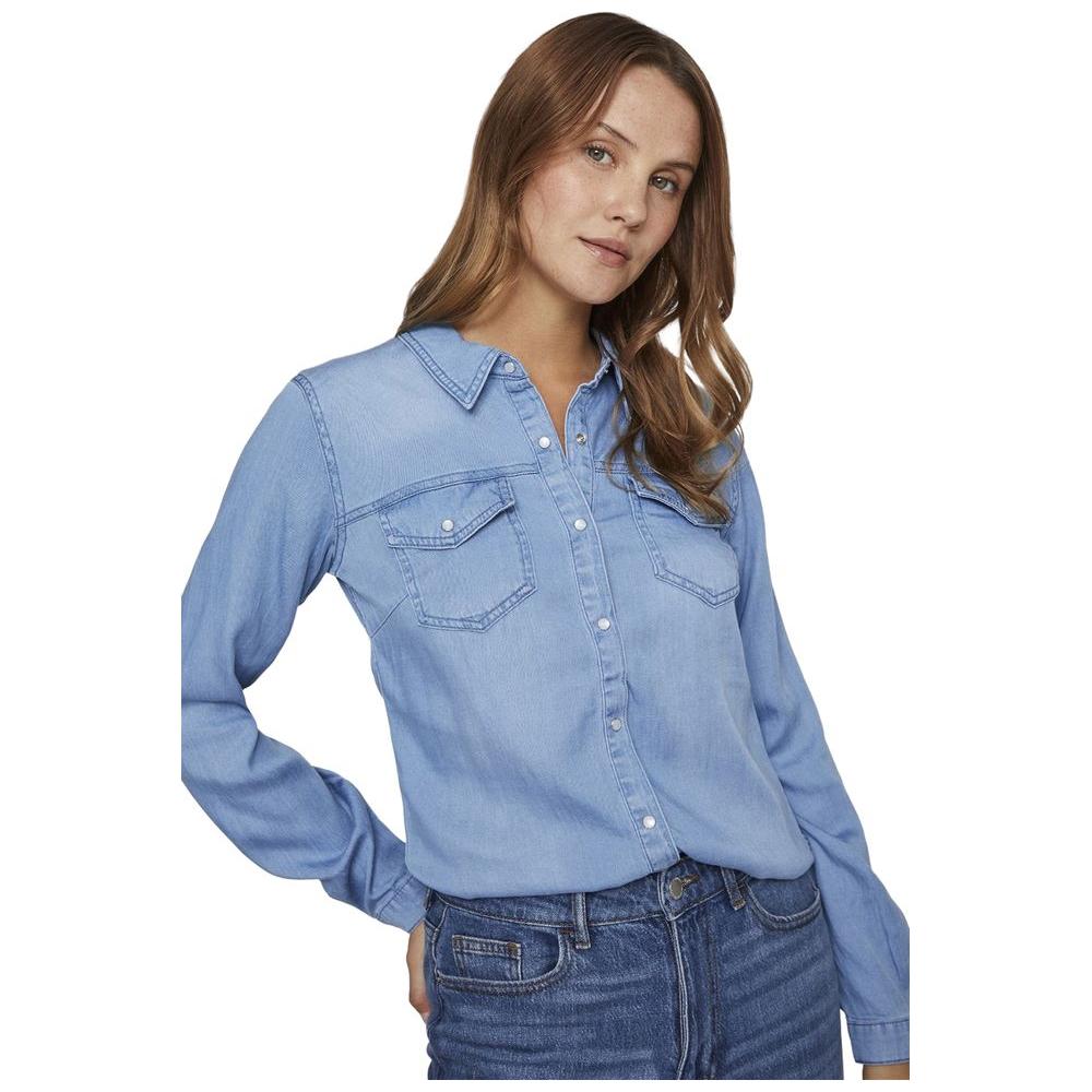Vila Clothes light blue cotton shirt with chest pockets and front buttons, modeled by a woman; perfect for casual or formal wear.
