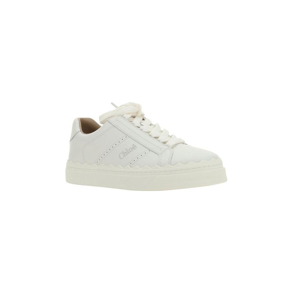 Chloé Lauren calfskin sneakers with lace-up front, round toe, flat sole, perforated sides, and brand monogram on tongue and side panels.