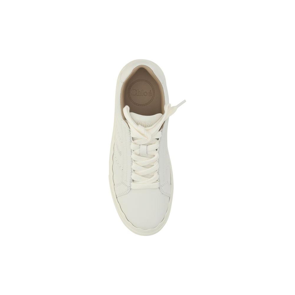 Top view of Chloé Lauren calfskin sneakers featuring lace-up front, perforated side detailing, and brand logo on insole.