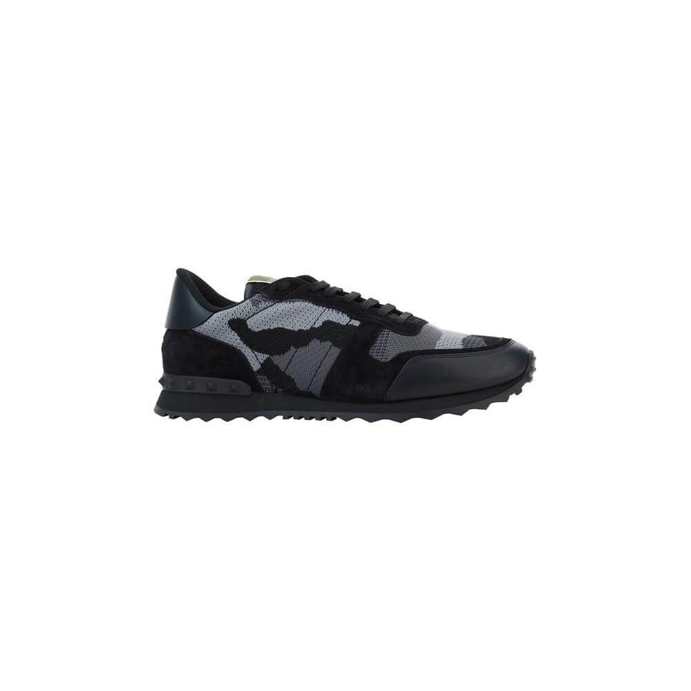 Valentino Garavani sneakers with camouflage design, lace-up closure, round toe, leather detailing, textured sole, brand studs at heel.