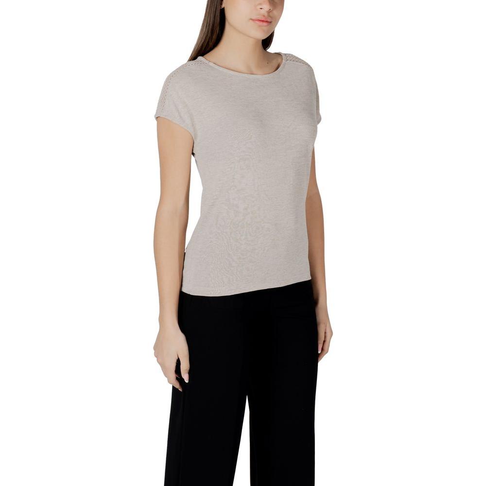 Woman wearing Street One beige short-sleeve t-shirt with lace shoulders, made from polyester-viscose blend, paired with black pants.