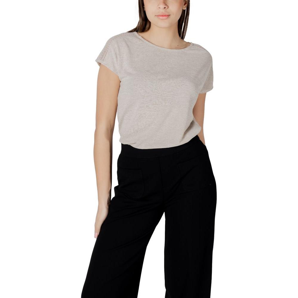 Woman wearing Street One Beige Polyester T-Shirt with laced shoulders, paired with black pants, showcasing stylish and versatile design.