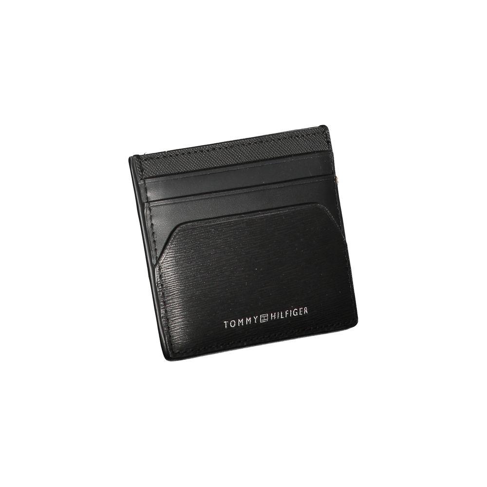 Tommy Hilfiger black leather wallet with card holder, central pocket, and printed logo.