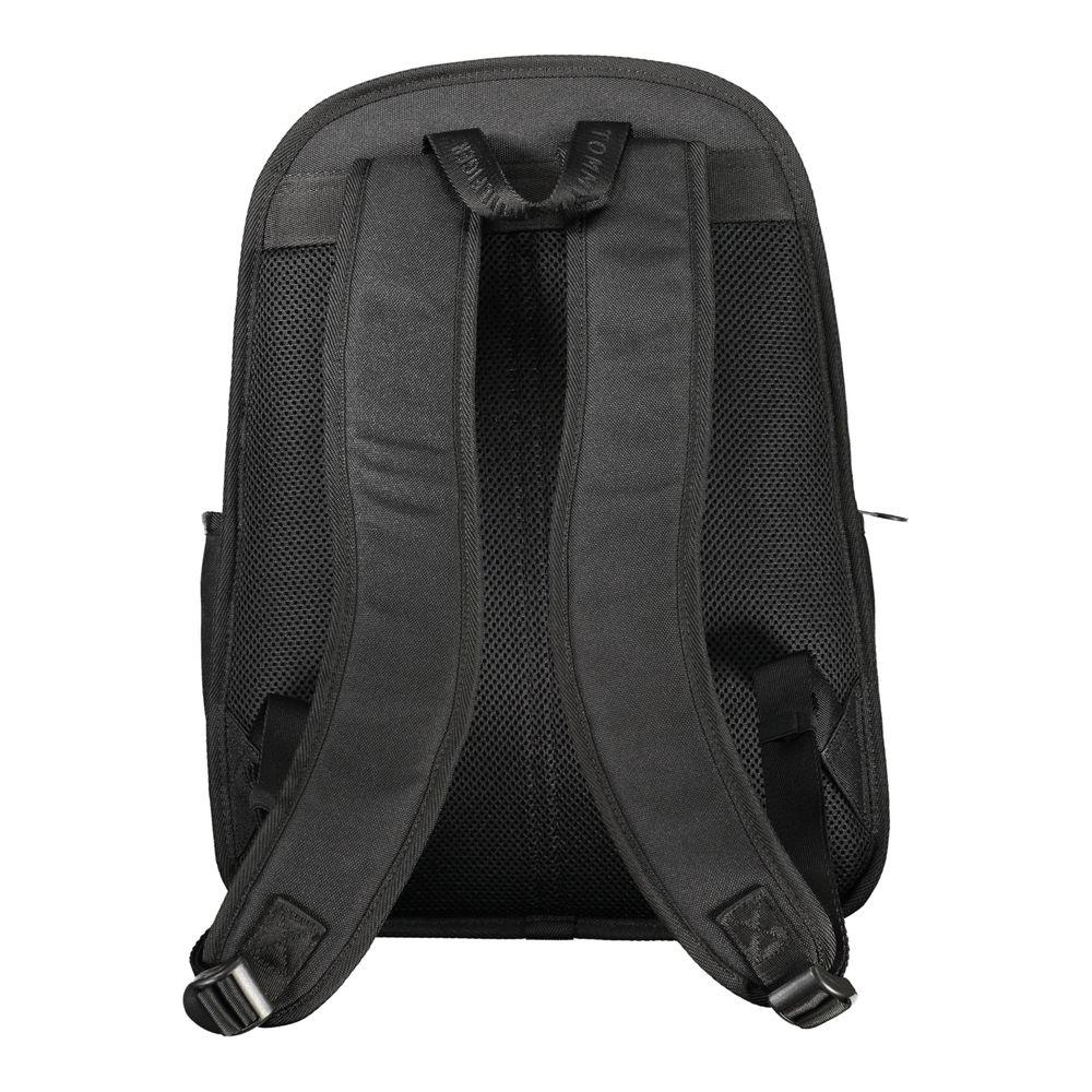 Back view of Tommy Hilfiger black polyester backpack with adjustable shoulder straps and breathable back panel.