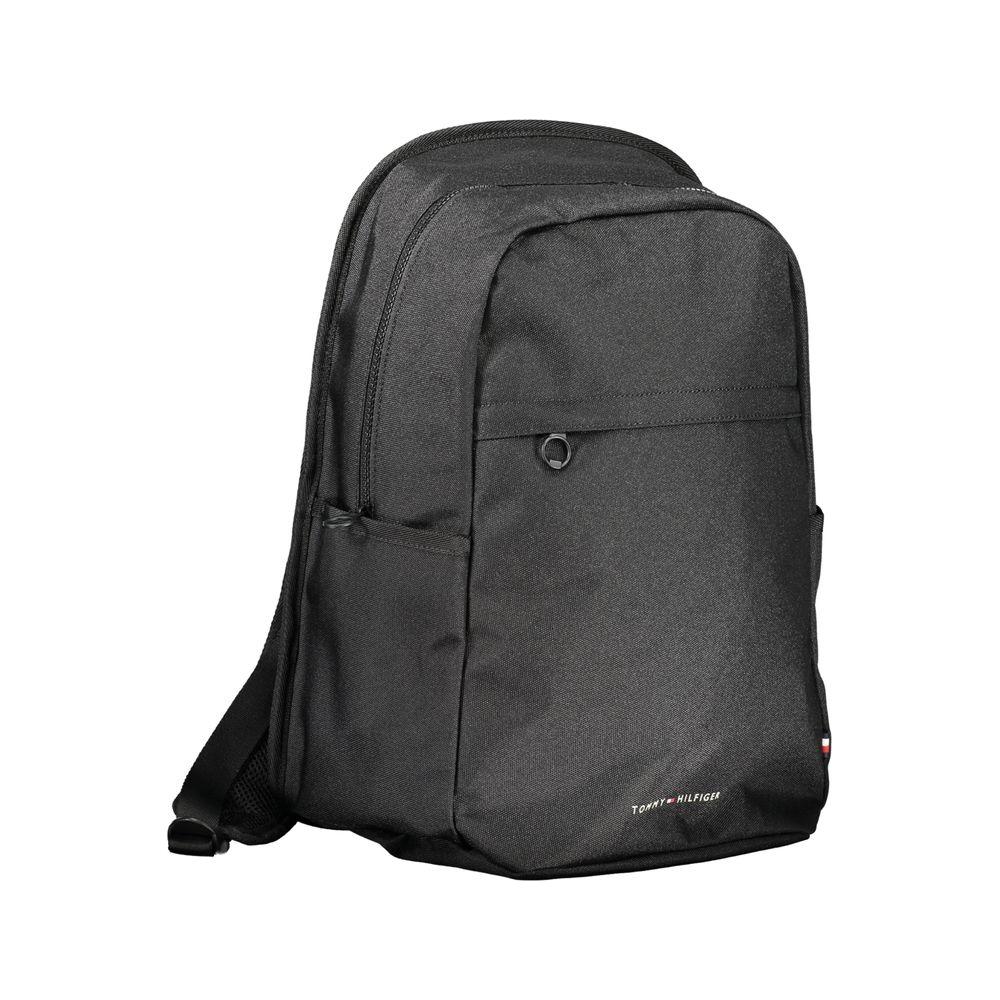 Sleek black Tommy Hilfiger polyester backpack with adjustable straps, multiple pockets, and a laptop compartment.