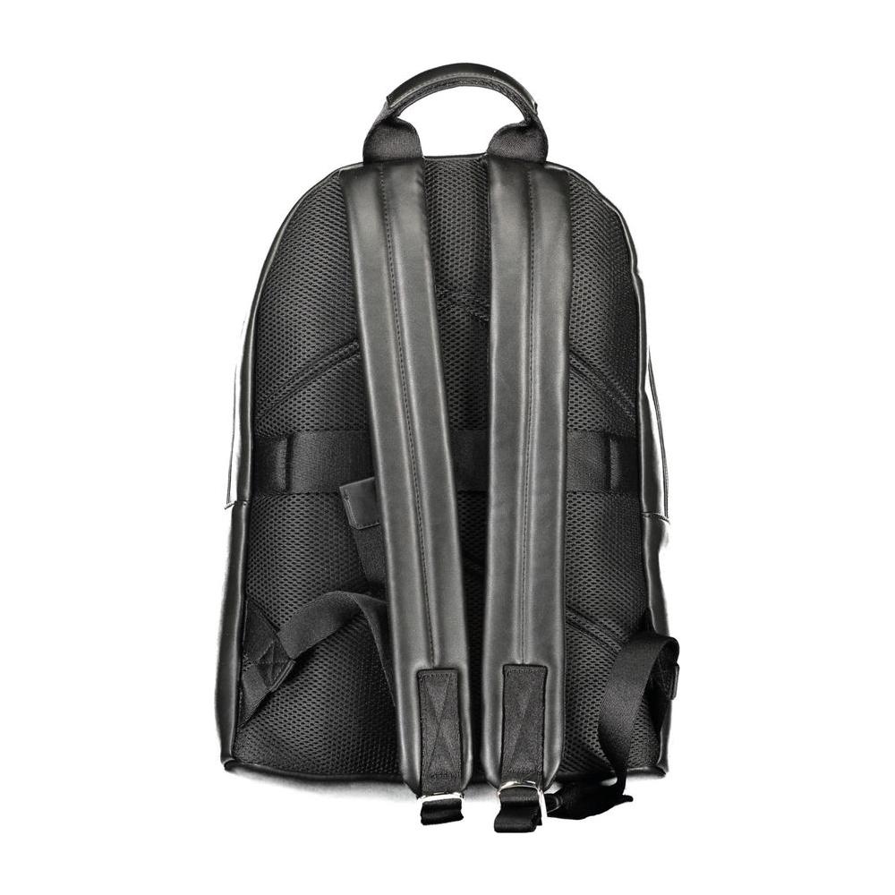 Back view of a black Calvin Klein men's backpack with adjustable straps and mesh design.